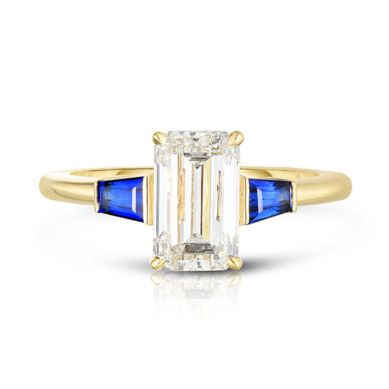 The Emerald Cut Three Stone Ring with Blue Sapphire Tapered Baguettes