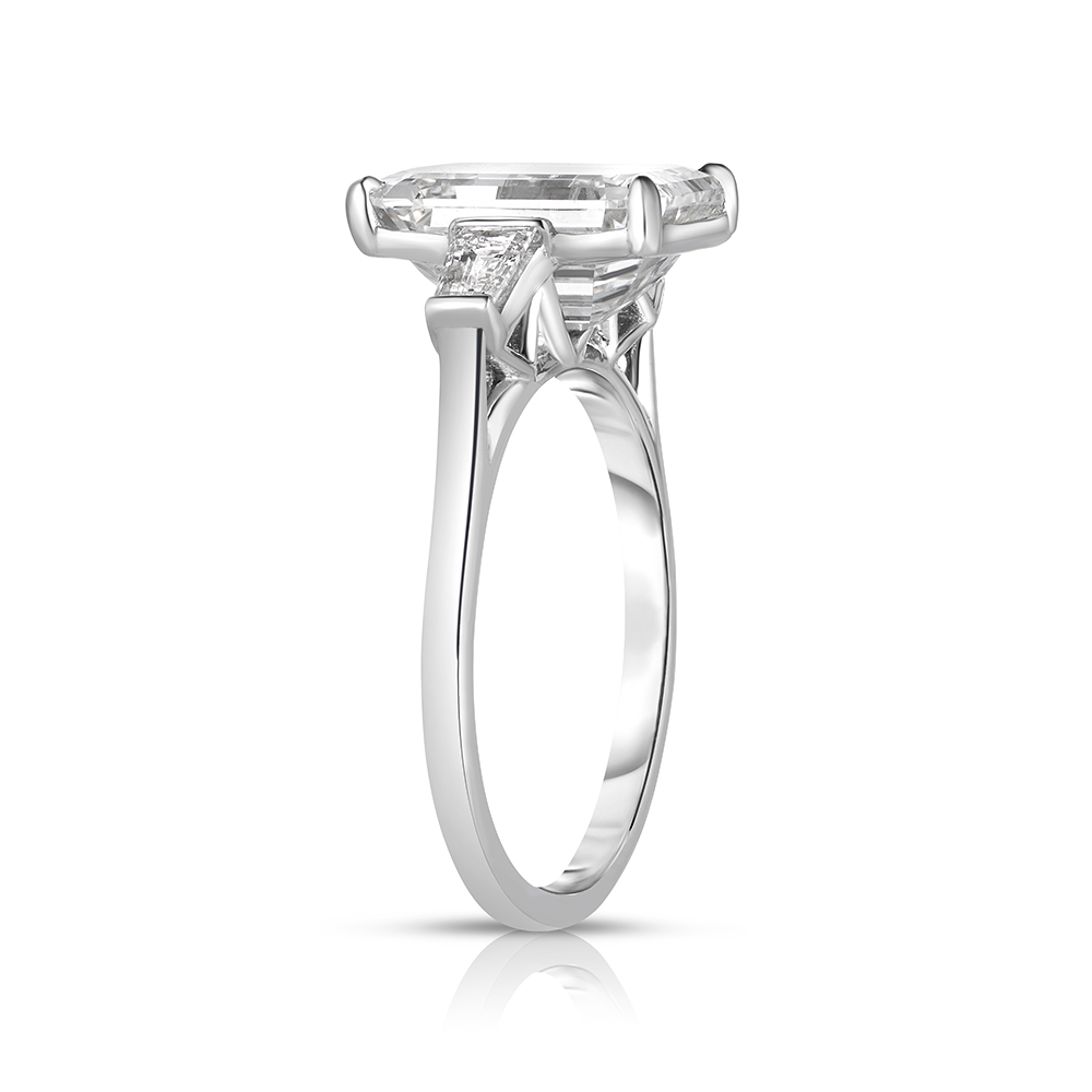 Flush Fitting Emerald Cut Three Stone Ring with Tapered Baguettes | Marisa Perry by Douglas Elliott Flush Fitting Emerald Cut Three Stone Ring with Tapered Baguettes | Marisa Perry by Douglas Elliott