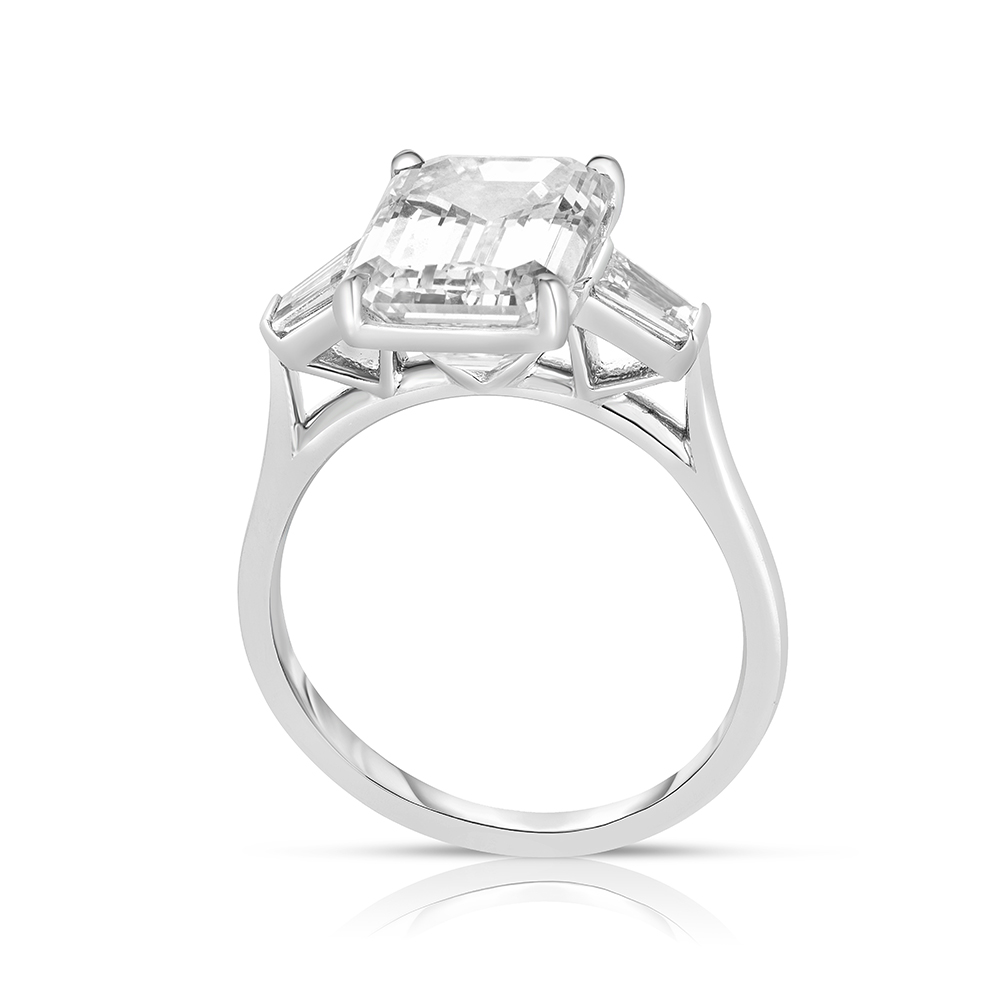Flush Fitting Emerald Cut Three Stone Ring with Tapered Baguettes | Marisa Perry by Douglas Elliott Flush Fitting Emerald Cut Three Stone Ring with Tapered Baguettes | Marisa Perry by Douglas Elliott